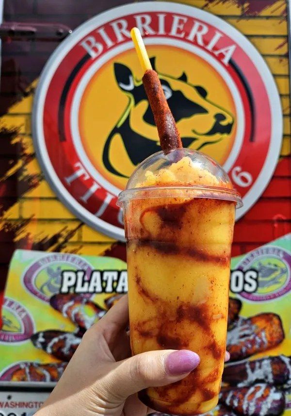 Mangonada with chamoy, tajín, and a tamarind straw