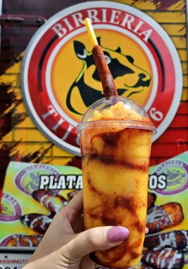 Mangonada with chamoy, tajín, and a tamarind straw